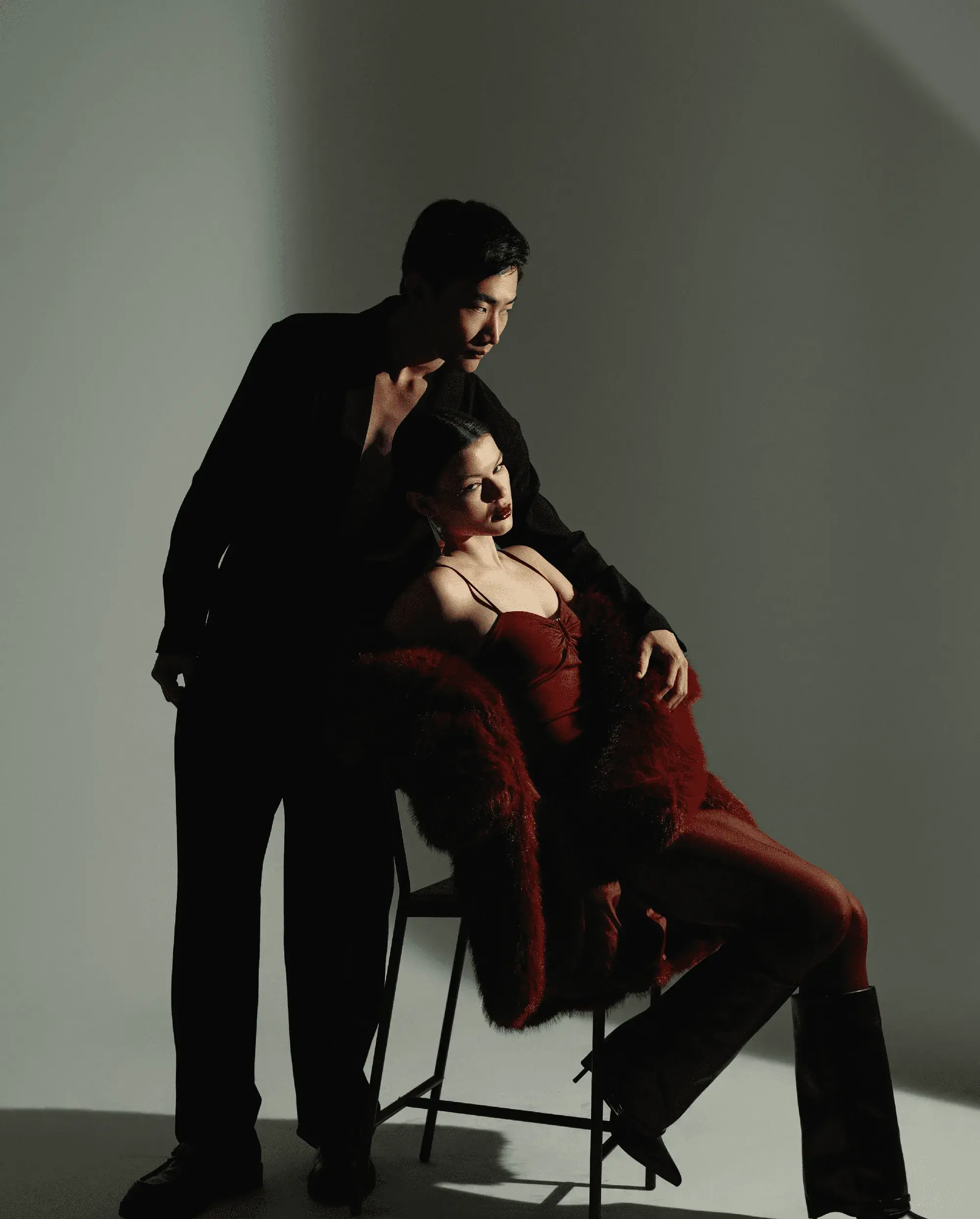 Editorial portrait of a couple in black and red
